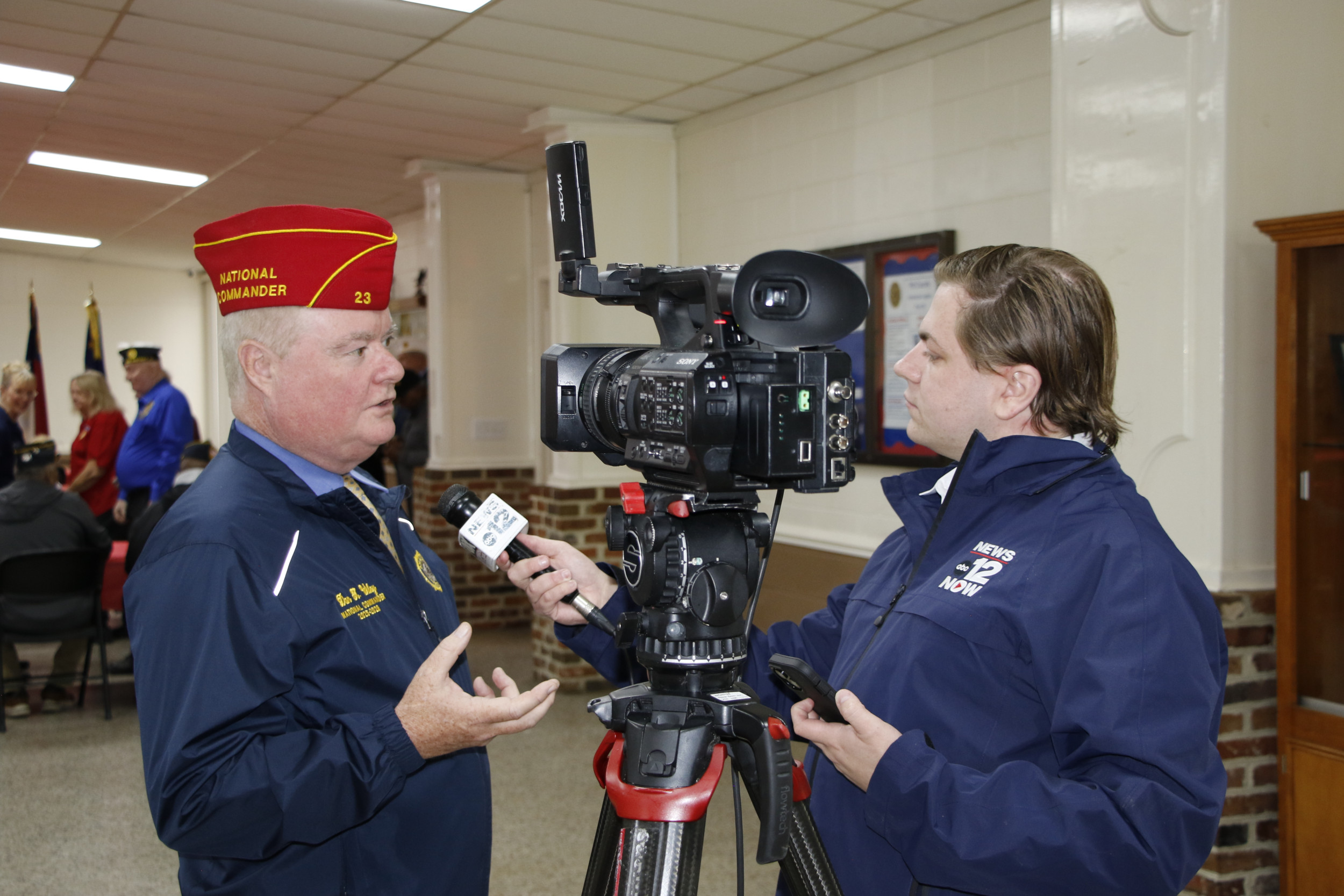 Commander Wiley interviews with a news station at Post 39 in Greenville.
