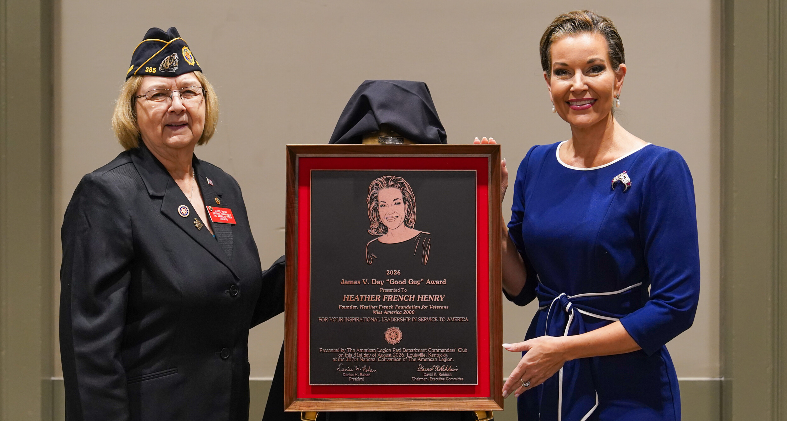 Past National Commander Denise Rohan presents the 2026 Good Guy Award to Heather French Henry.