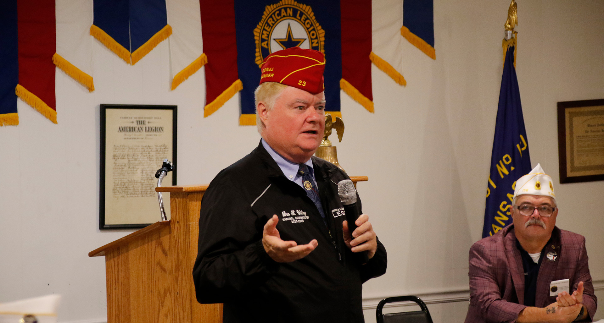Commander Wiley delivers a message to members at a post in Kansas.