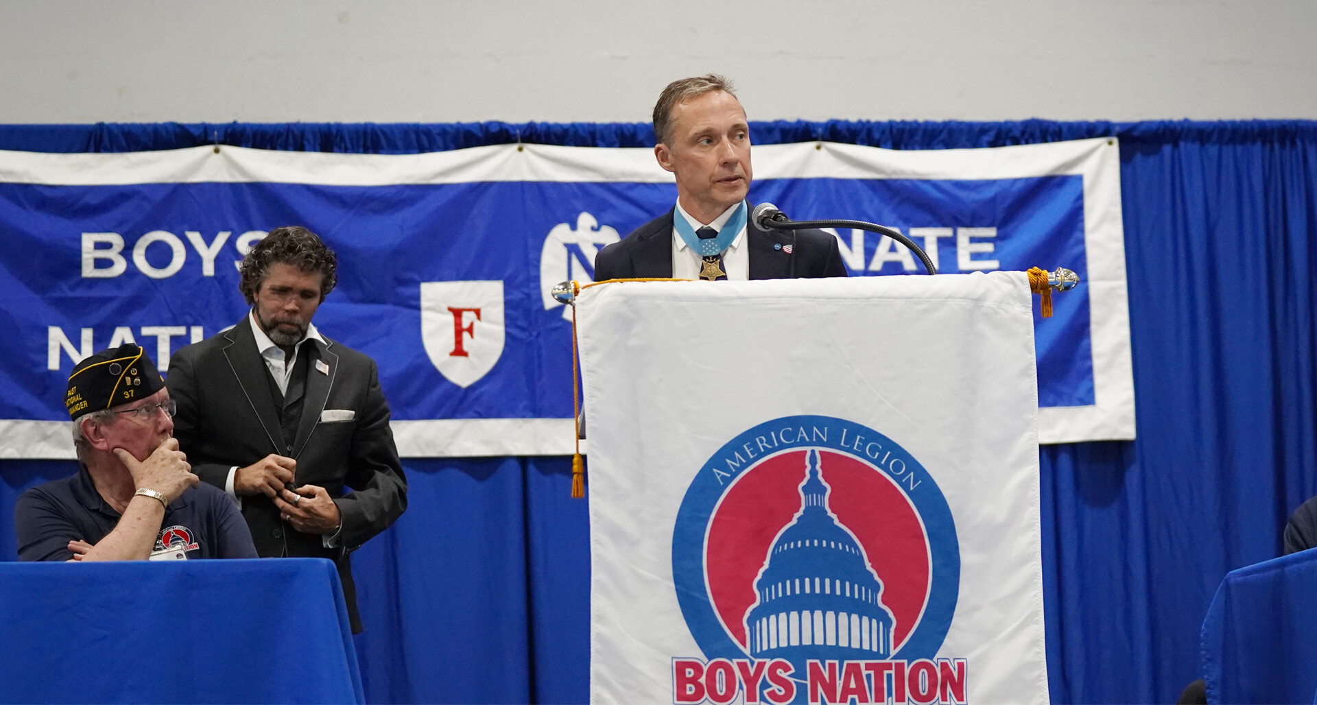Medal of Honor Society President Britt Slabinski, at podium, and retired Navy SEAL Jason Redman, standing left, spoke to Boys Nation 2026 on Thursday, July 23. Photo by Jennifer Blohm