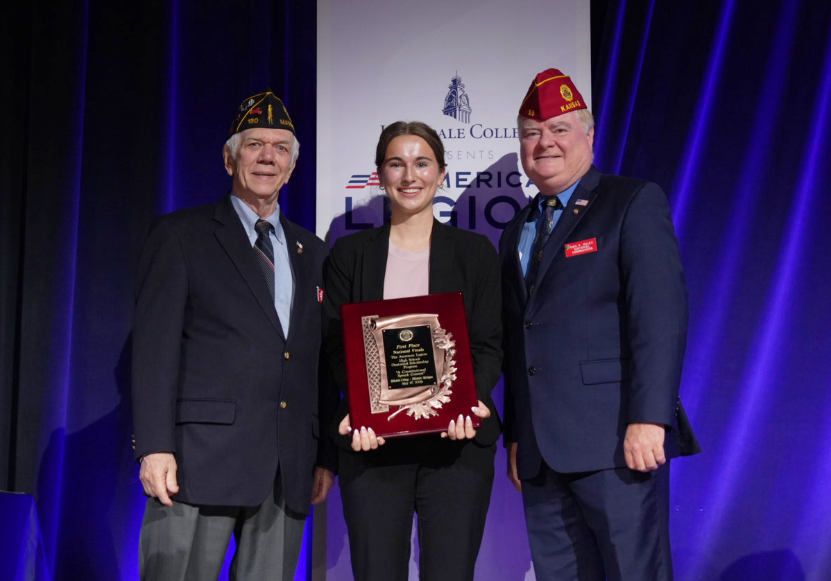 National Oratorical Contest winner Juliet Hetzel of Colorado stands with Americanism Chairman Mark Avis and National Commander Dan Wiley. Photo by Jennifer Blohm/The American Legion