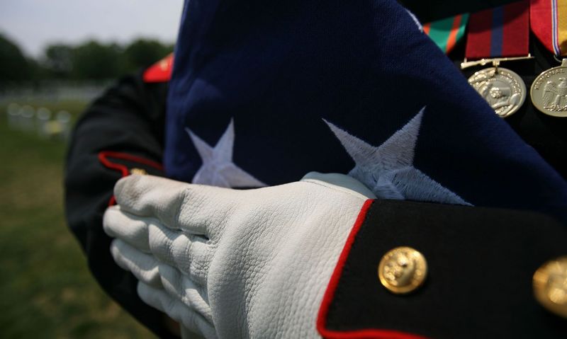 A folded flag ‘carries the spirit and memories of our loved ones’