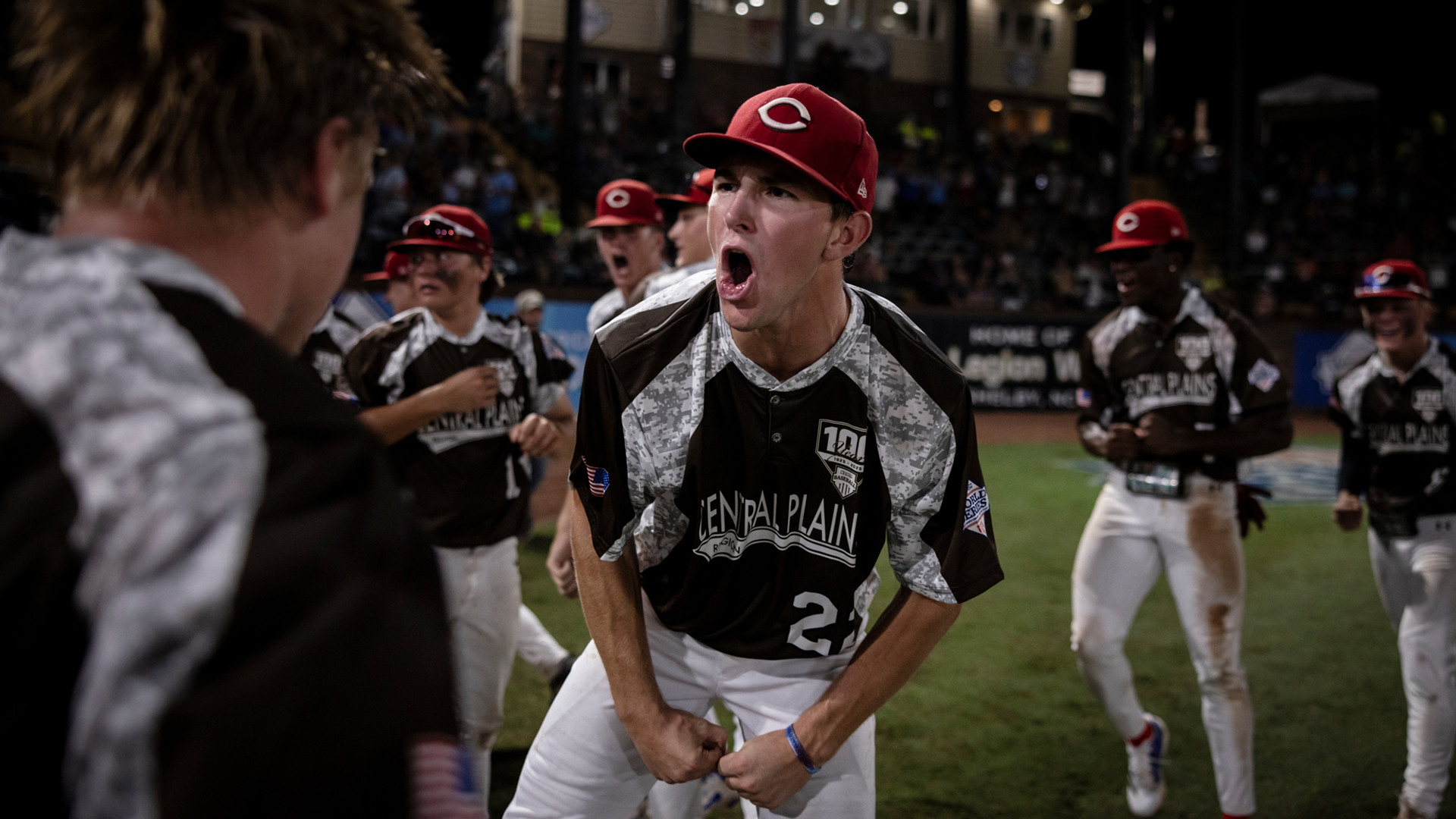 Trevor Roach of Lincoln, Neb. Post 500 celebrates with his teammates after a home run during Game 8 of the 2025 American Legion World Series. Photo by Chet Strange