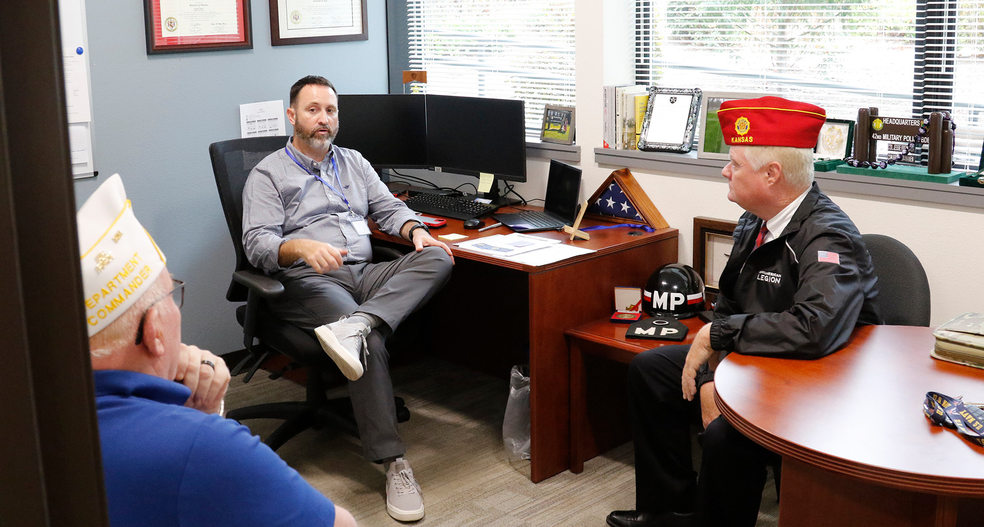 National Commander Dan K. Wiley meets with staff at Lacy Veterans Service Hub.