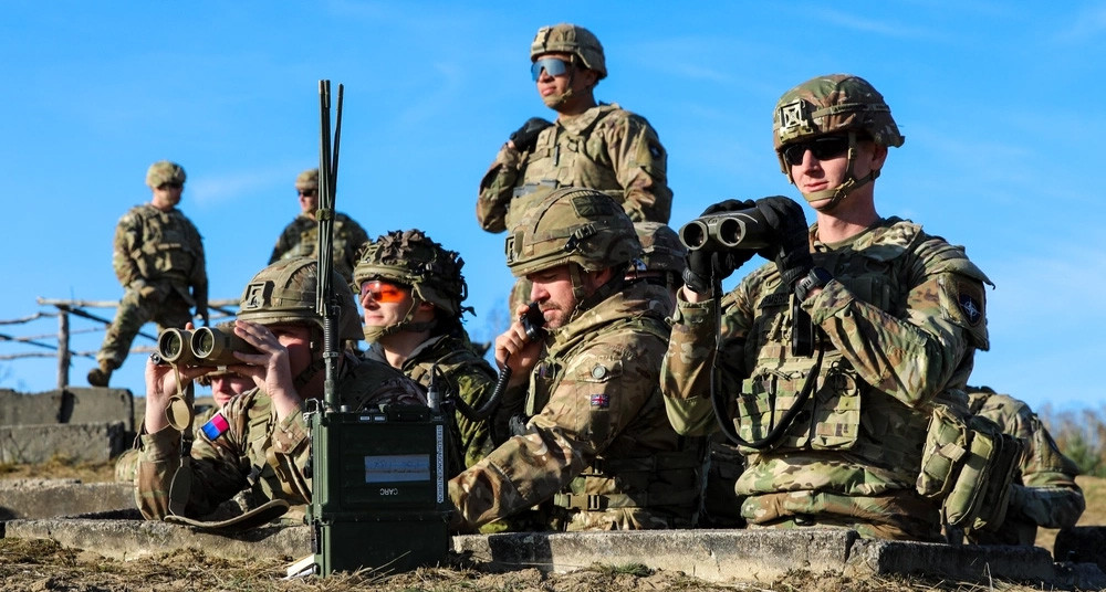NATO enhanced Forward Presence Battlegroup Poland. U.S. and U.K. soldiers confirm a call for fire support during a live fire exercise. (U.S. Army National Guard photo by Sgt. Gavin K. Ching)