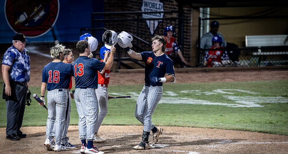 Wyatt McDaniels of Tupelo, Miss. Post 49 celebrates a home run with his team during Game 12 of the 2026 American Legion World Series. Photo by Chet Strange