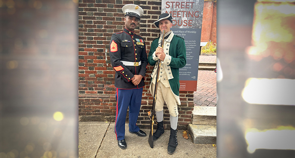 Marine Gunnery Sgt. Yonas Reinholdson of the Villanova NROTC with Marine Corps veteran Walter Wahle.