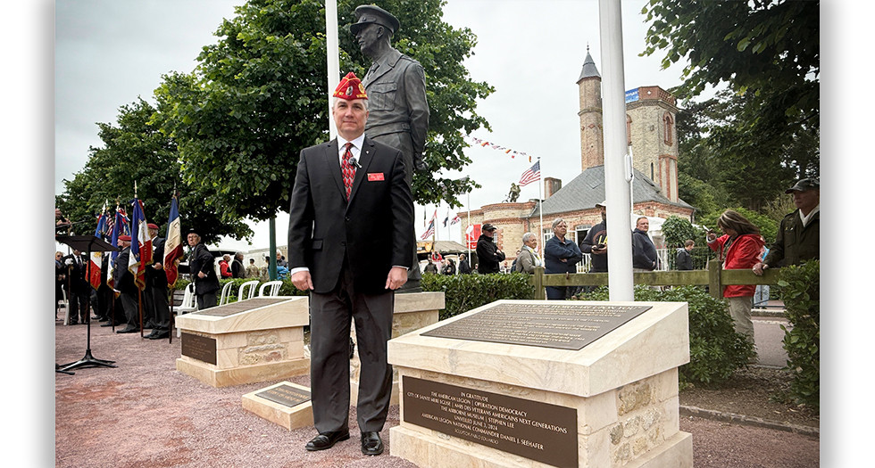 Past National Commander Daniel Seehafer speaks during the dedication of the Statues of Liberation Memorial in Sainte Mere-Eglise, Normandy, France on 81st Anniversary of D-Day. Photo by Jeff Stoffer