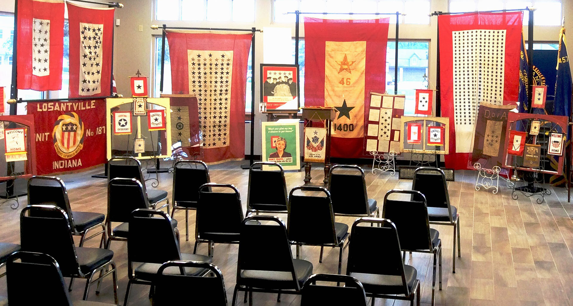 A collection of Mark Hutson's service flags on display at the Department of Illinois convention. (Photo via Austin May)