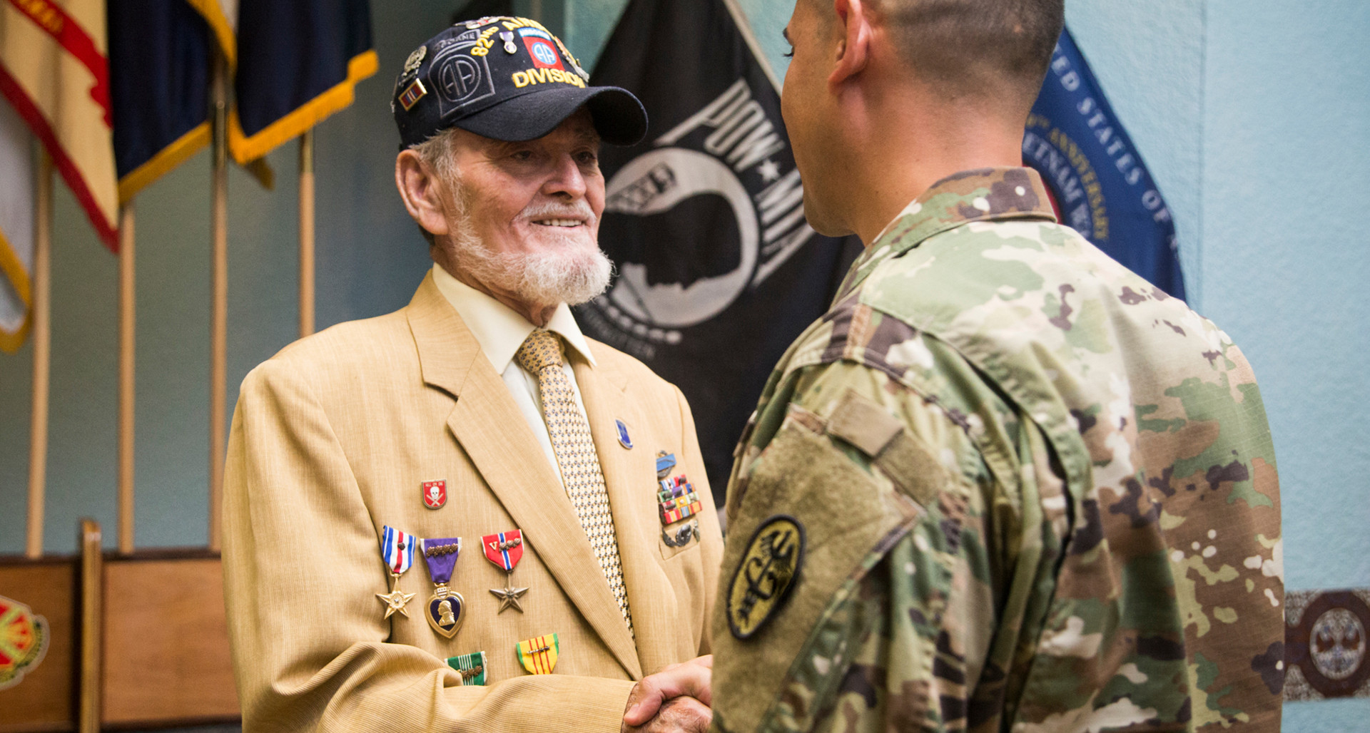 Jorge Otero-Barreto is congratulated by Lt. Col. Eli Lozano after Otero-Barreto received a Distinguished Member of Regiment Certificate and Pin on June 17, 2016. Photo by Erika P. Rodriguez.