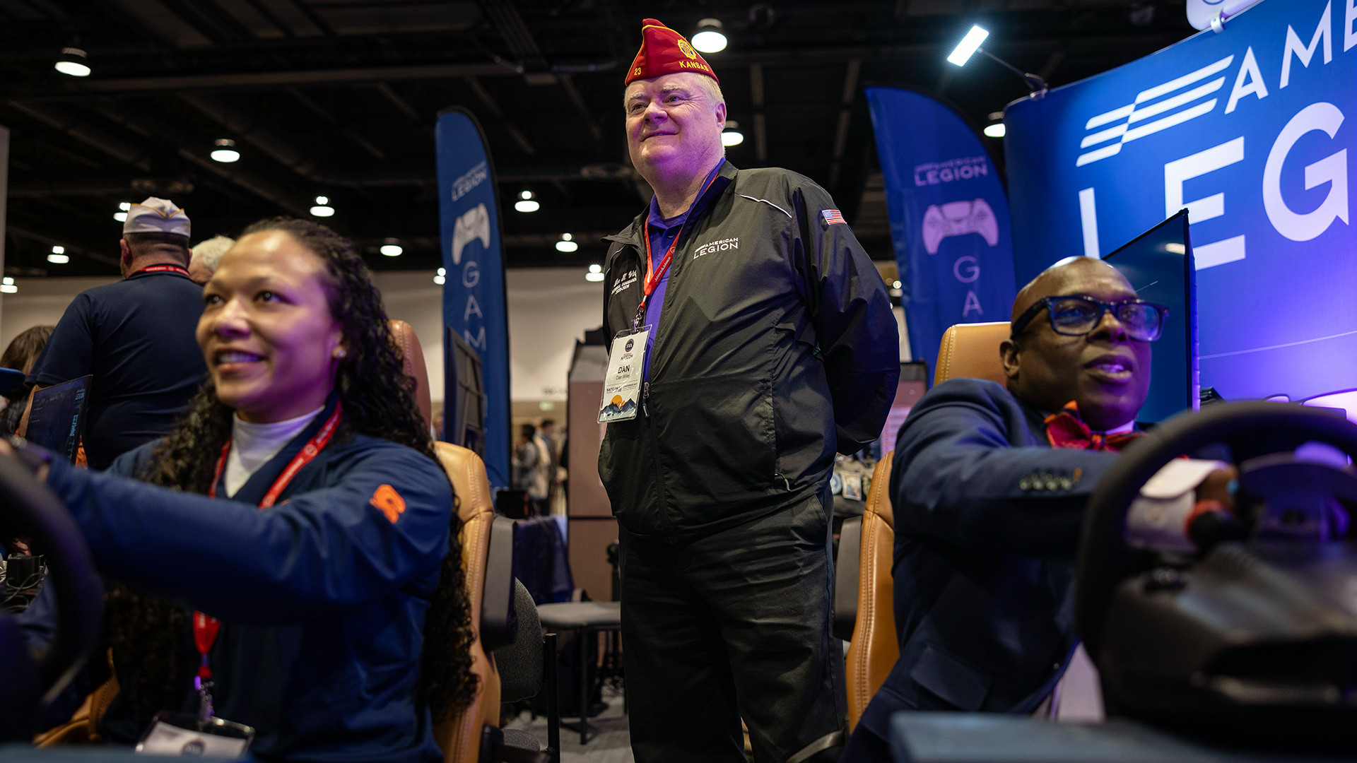 American Legion National Commander Dan K. Wiley observes as attendees play video games in The American Legion booth at the 2026 Student Veterans of America NatCon. Photo by Chet Strange