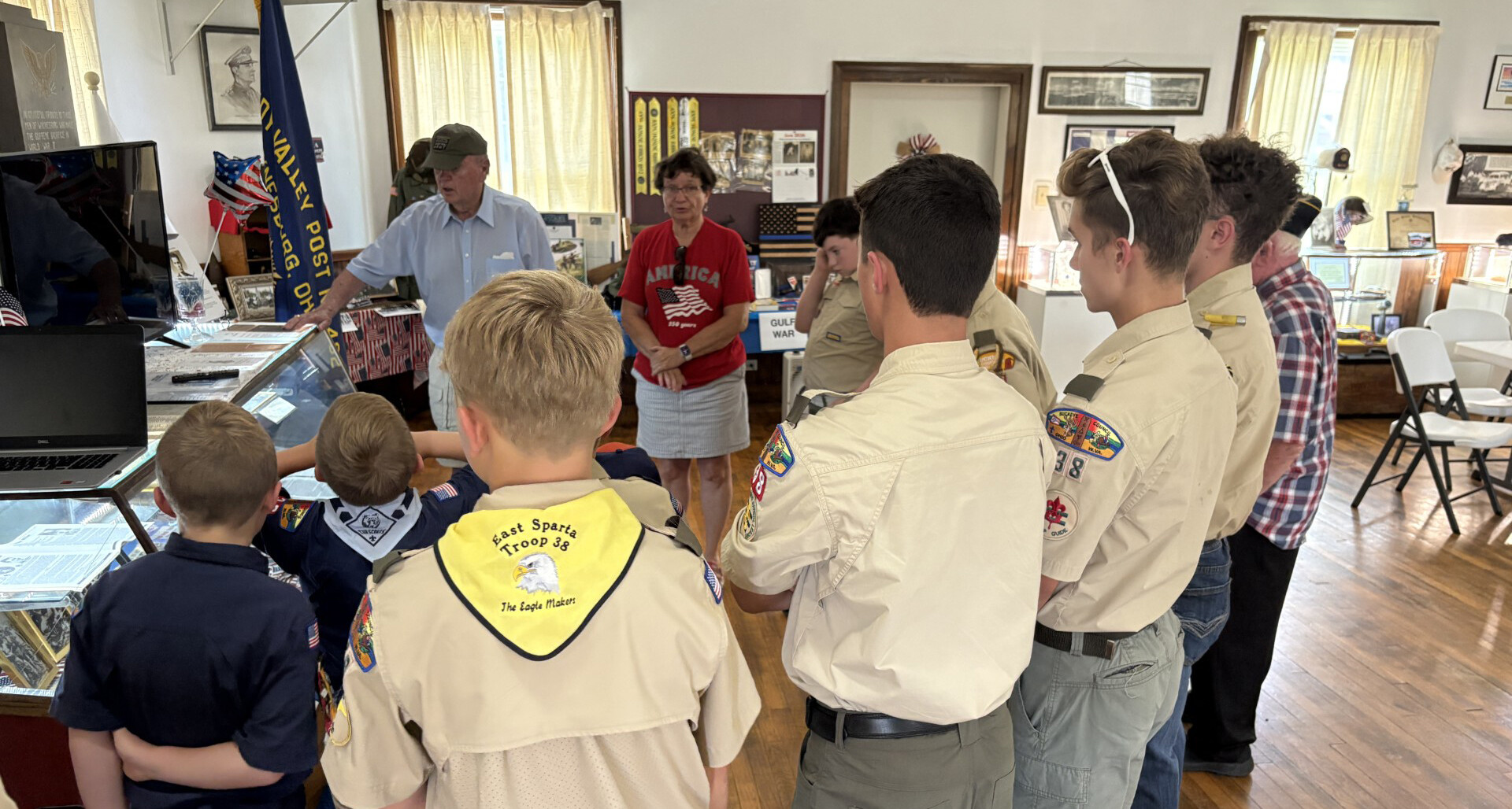 Hugh Roberts and Carmen Swihart speak with Scouts at Post 432’s museum.