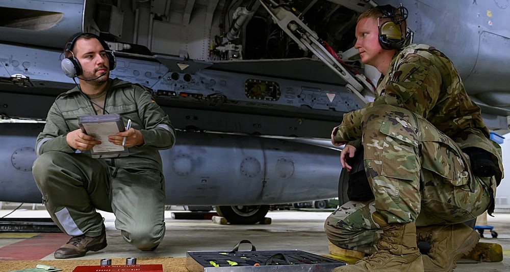 U.S. Air Force and a German Air Force 33rd Tactical Air Wing weapons loader at Büchel Air Base, Germany, June 26, 2025. (U.S. Air Force photo by Staff Sgt. Max J. Daigle)