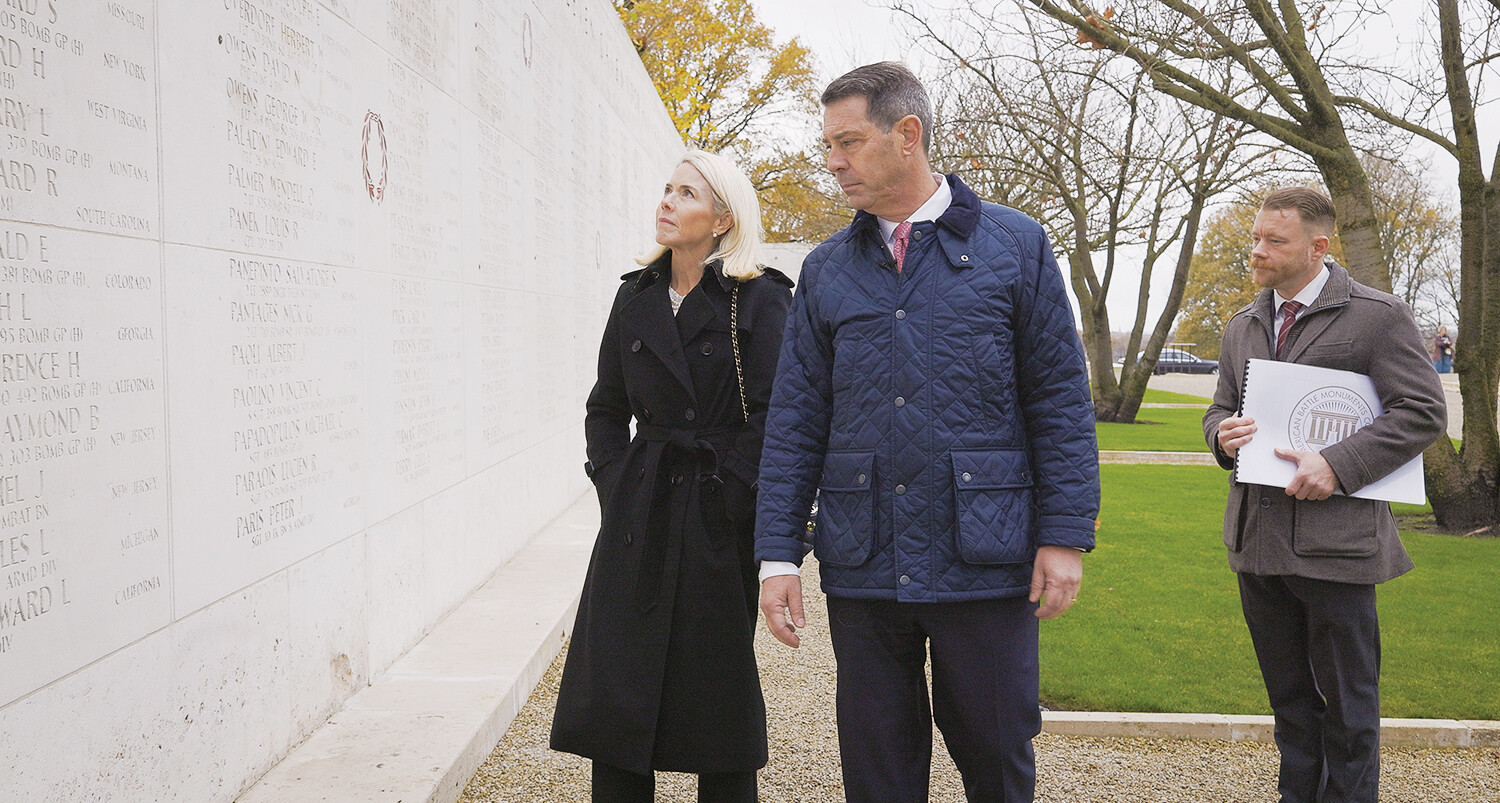 Ambassador Joseph Popolo, center, tours the Netherlands American Cemetery.