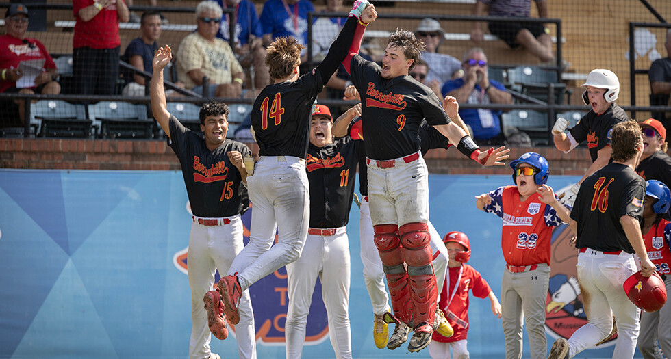 Owen Dominowski of Midland, Mich., Berryhill Post 165 celebrates his home run with teammate Cayden Nieto during Game 1 of the 2026 American Legion World Series in Shelby, N.C. Photo by Chet Strange