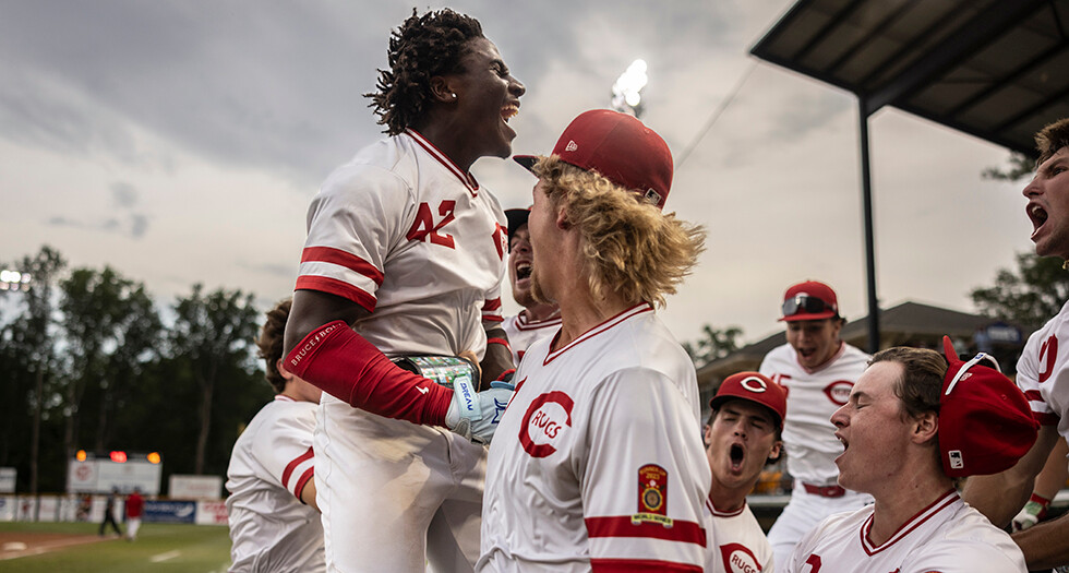 Dele Odulate of Lincoln, Neb. Carpet Land Post 500 celebrates with his team after hitting a grand slam during Game 14 of the 2026 American Legion World Series. Photo by Chet Strange