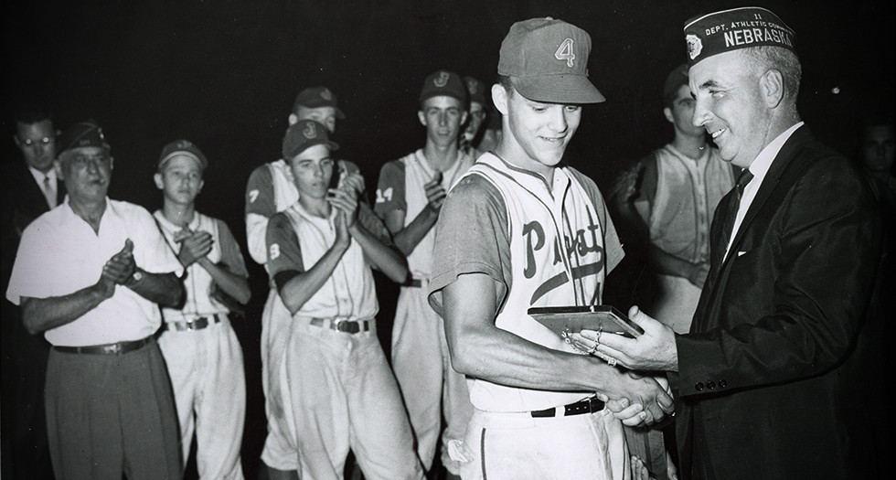 Robert Fry, Billings, Mont. centerfielder, receives the 1960 James F. Daniel Sportsmanship Award from Fred Irons, assistant director, the National Final Tournament.