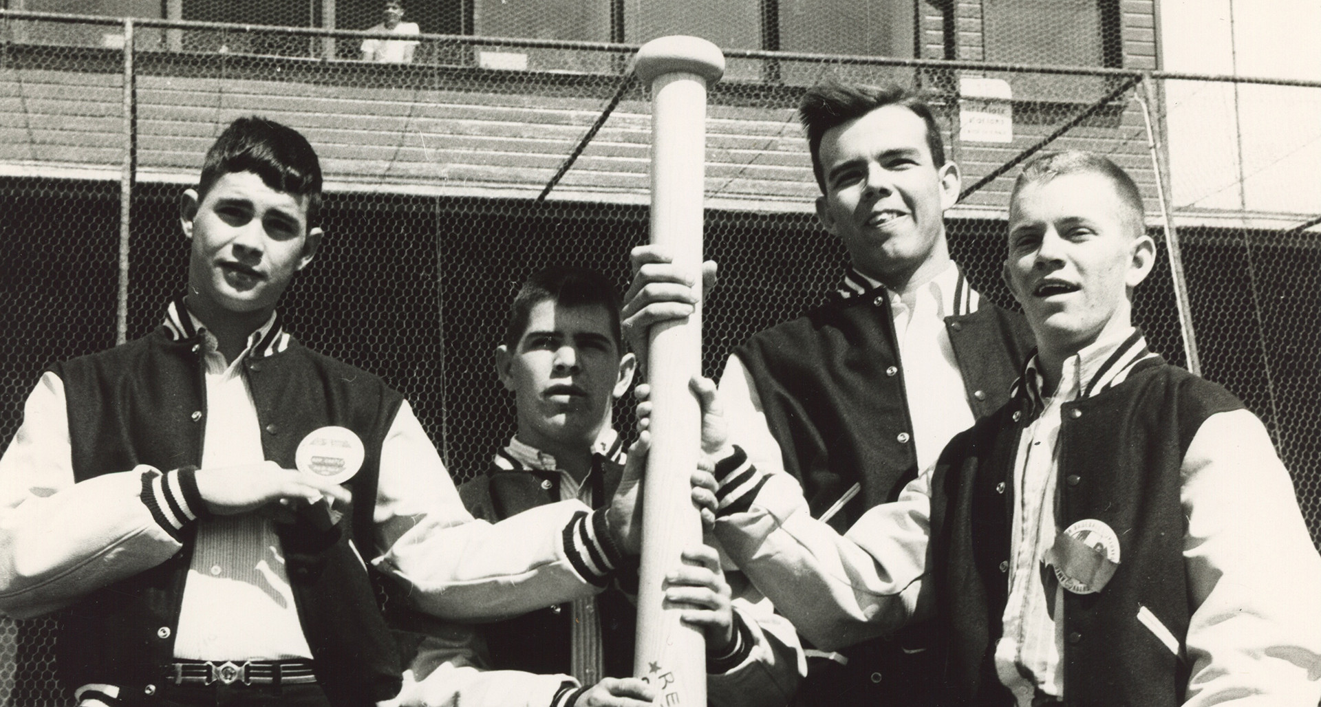 Players from Portland (Ore.) Post 150 hold the giant bat awarded at the 1965 American Legion World Series.
