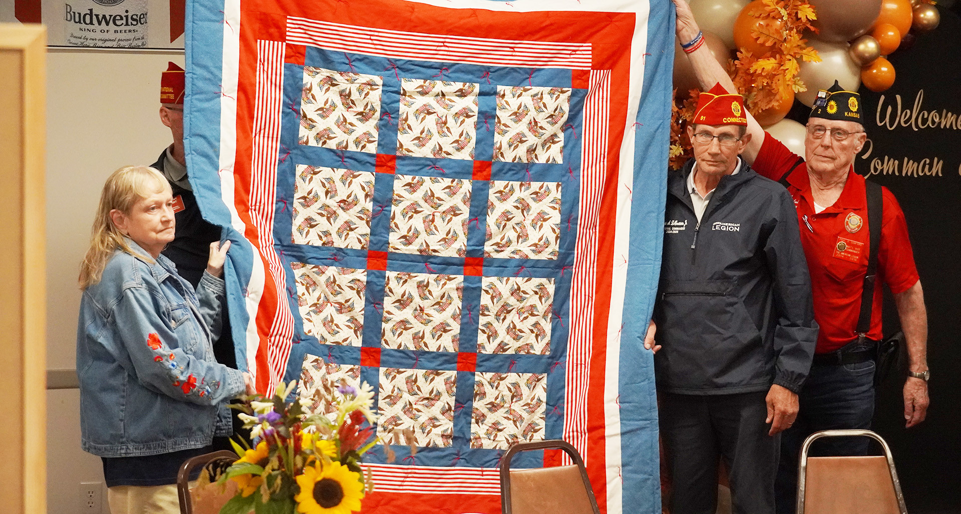 The National Commander receives a quilt from Wayne G. Austin Post 2 in Newton, Kan.