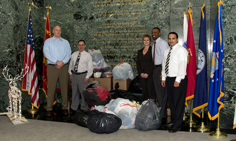 Legion staff make a warm donation