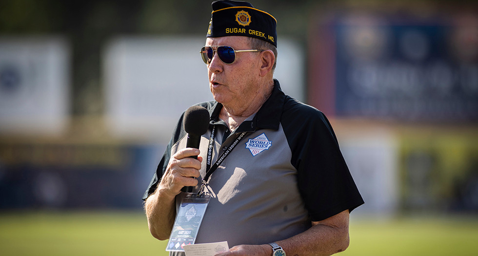 American Legion Baseball Committee Chairman Gary Stone addresses players before game 1 of The 2024 American Legion World Series. Photo by Chet Strange/The American Legion