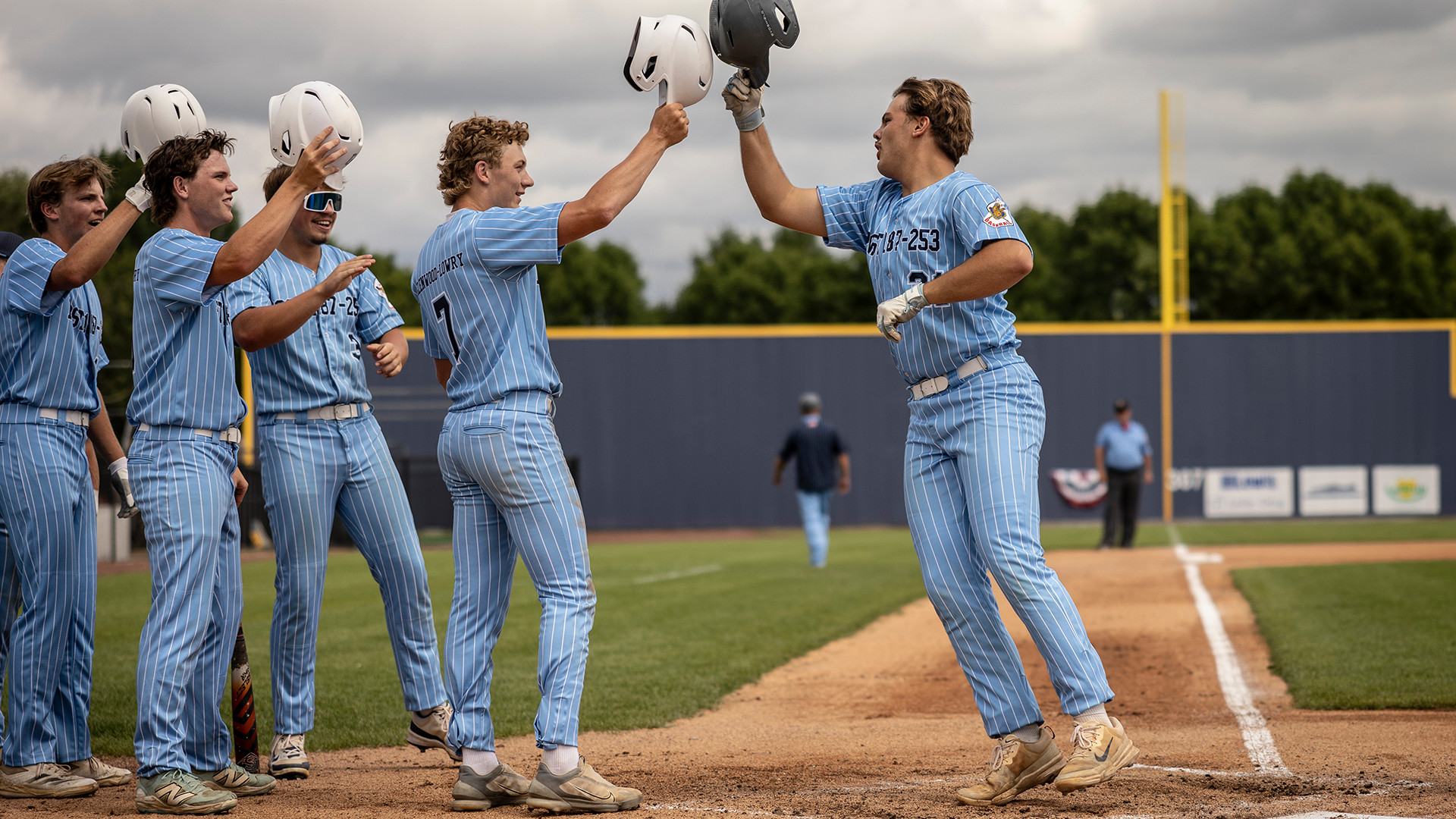 Noah Jensen of Glenwood-Lowry Post 187/253 celebrates with his team after hitting a home run during Game 1 of The American Legion Centennial Classic Milbank, S.D. Photo by Chet Strange