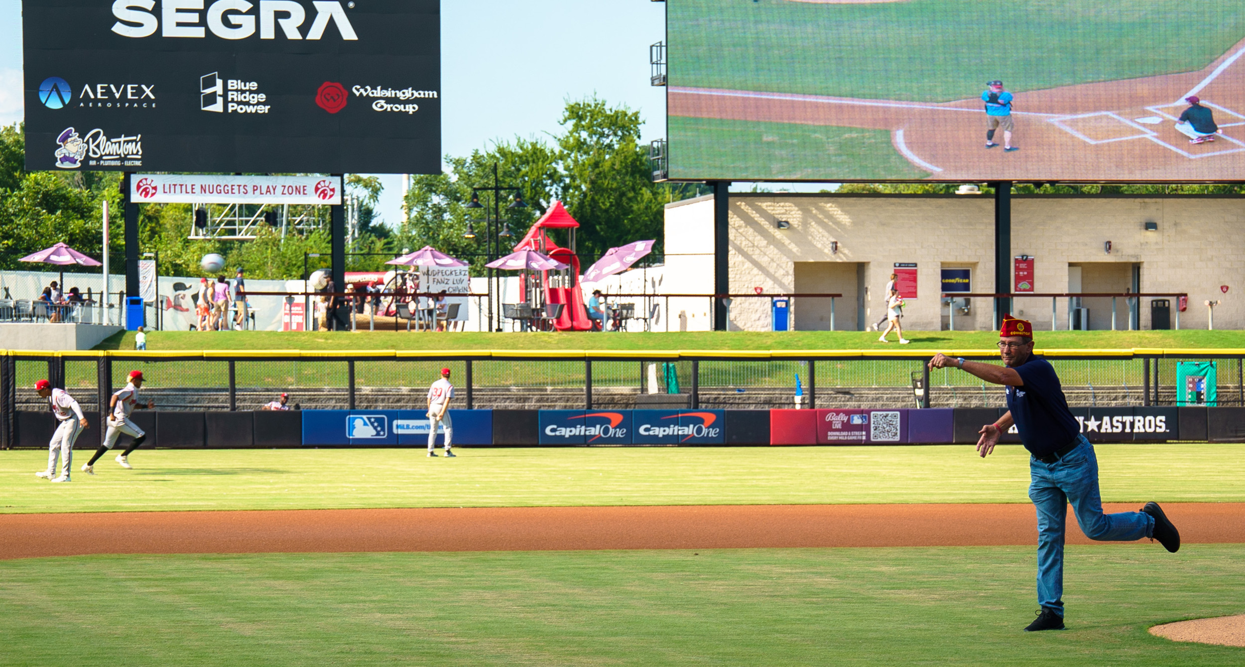 National Commander James LaCoursiere throws the first pitch before the Fayetteville Woodpeckers game. Photo by Jennifer Blohm/The American Legion