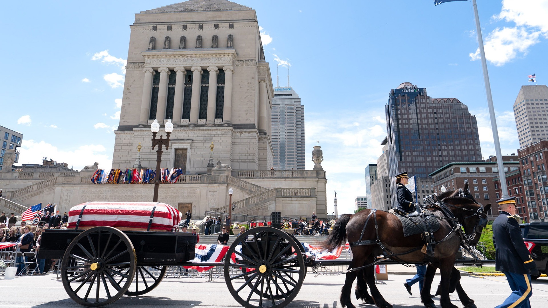 The Military Department of Indiana Ceremonial Unit caisson passes In front of the Indiana War Memorial. Photo by Hilary Ott