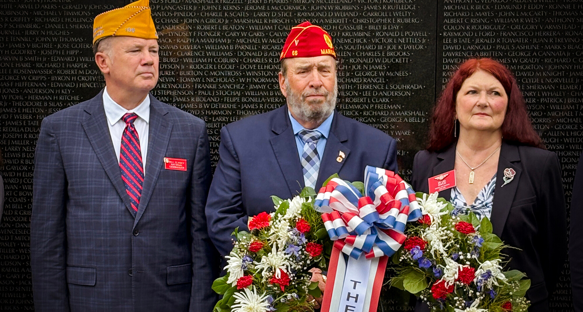 SAL National Commander William Clancy, AL National Vice Commander J.D. Larson and ALA VA&R Chair Lisa Chaplin place a wreath at the Vietnam Veterans Memorial. (Photo by Henry Howard)