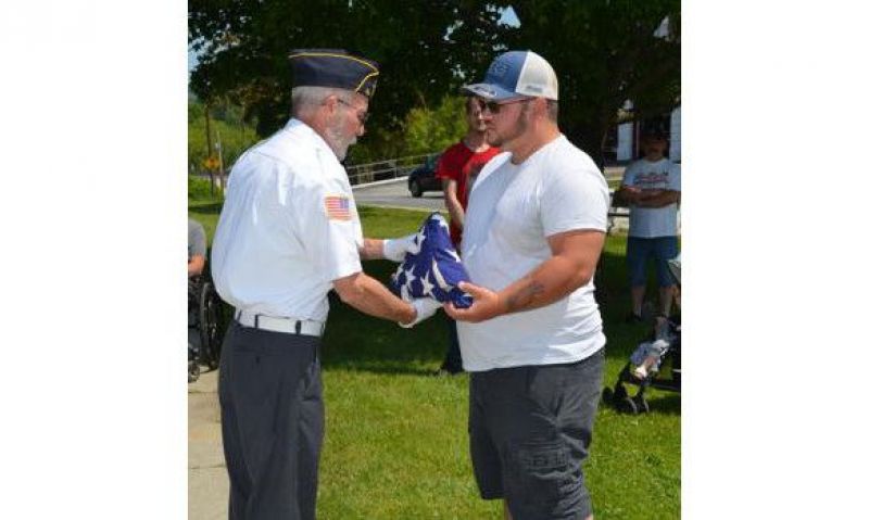 Flag that survived fire re-presented to family of veteran it honored