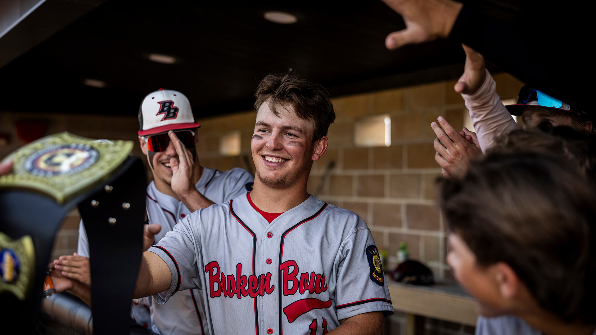 Max Denson of Broken Bow 126 receives a game belt after the team won Game 2 of The American Legion Centennial Classic in Milbank, S.D. Photo by Chet Strange