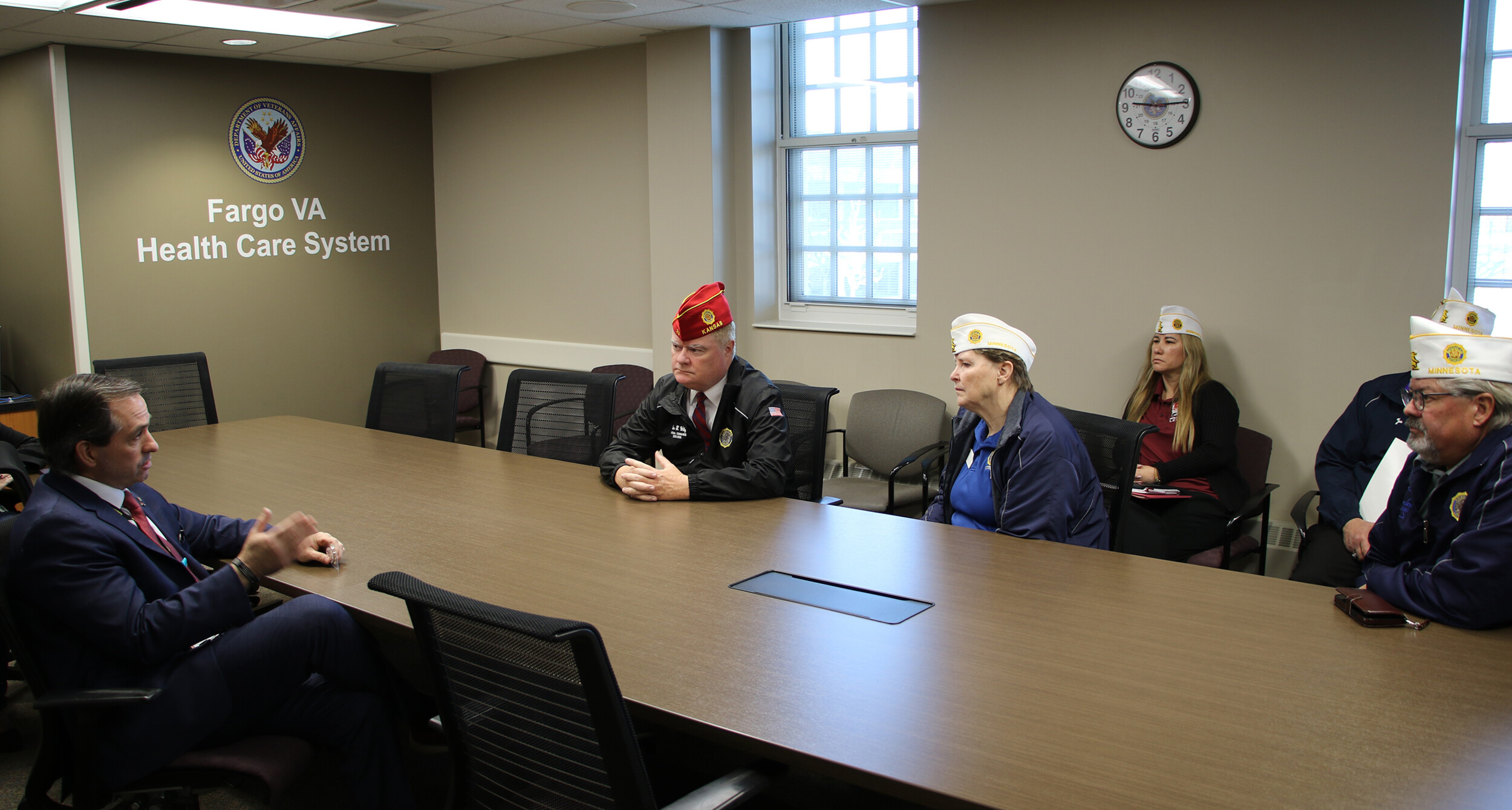 American Legion National Commander Dan Wiley meets with staff at the Fargo VA Health Care System.