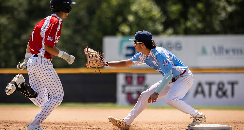 Kellan Komline of Whitehouse, N.J. Post 284 tags out Nico Fullen of the Fairfield, Calif. Expos during Game 7 of The American Legion World Series. Photo by Chet Strange
