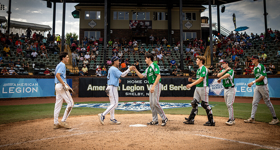 Bedford, N.H., Post 54 and Portland, Ore. Post 158 congratulate one another after Portland’s win in Game 5 of the 2026 American Legion World Series in Shelby, N.C. Photo by Chet Strange