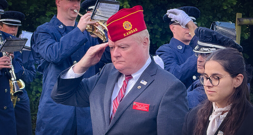 National Commander Dan K. Wiley salutes during a ceremony at the C47 Memorial Garden in Picauville, France.
