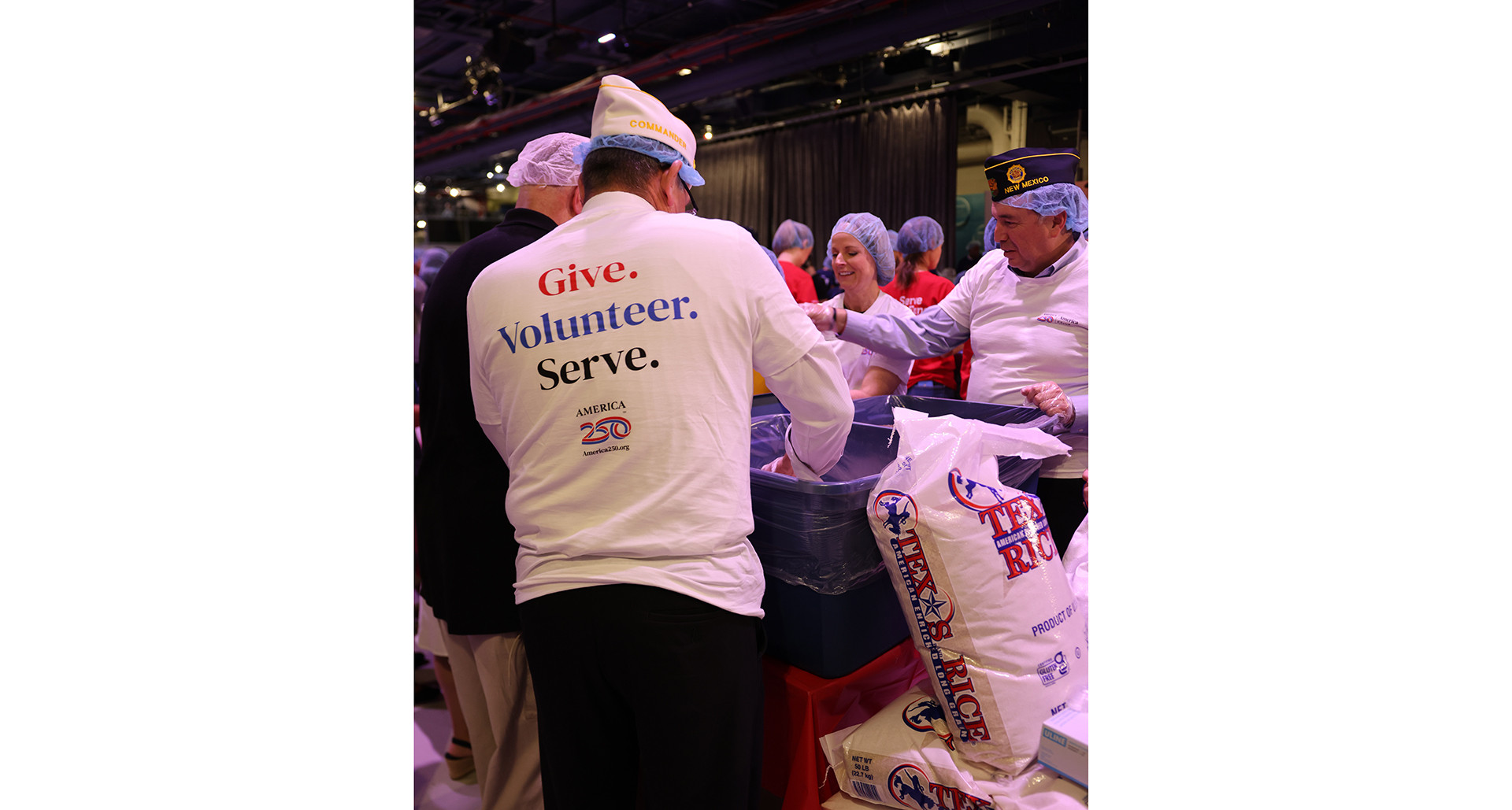 Legionnaires assist at an America250 food-packing event. (Photo via America250)