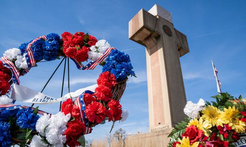 During the ceremony, wreaths were placed at the base of the Peace Cross.