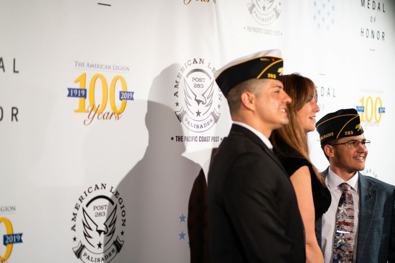 Attendees have their photo taken on the red carpet before American Legion Palisades, Calif., Post 283's 