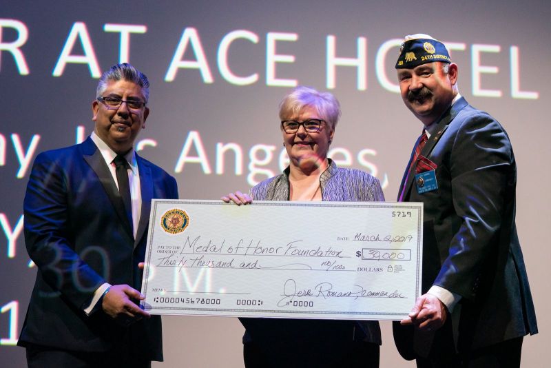 Commander Jere Romano and Adjutant Joe Ramirez of Palisades Post 283 present a check to the Medal of Honor Foundation for $30,000 from the post during American Legion Palisades, Calif., Post 283's 