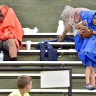 Fans put on their rain gear during game 13 of The American Legion World Series on Monday, August 14, 2017 in Shelby, N.C.. Henderson, Nev., Post 40 defeated Bryant, Ark., Post 298 7-3 in nine-innings. Photo by Matt Roth/The American Legion. 