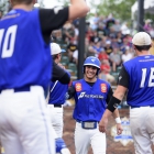 Lucas Ripa of Omaha, Neb., Post 1 high fives his teammates after scoring against Midland Mich., Post 165 during game 5 of The American Legion World Series on Friday, August 11, 2017 in Shelby, N.C.. Photo by Matt Roth/The American Legion. 