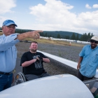 Tim Senkowski, center, listens to Jan Driessen, left, as he makes notes about a storm in the distance. Senkowski was given the opportunity to go on a flight in a glider as a part of an Operation Comfort Warriors grant during The American Legion's 99th annual National Convention in Truckee, Calif., on Saturday, August 19, 2017 Photo by Lucas Carter/The American Legion.