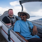Tim Senkowski, back, laughs with commercial glider pilot Pablo Sasso-Perkins before taking off. Senkowski was given the opportunity to go on a flight in a glider as a part of an Operation Comfort Warriors grant during The American Legion's 99th annual National Convention in Truckee, Calif., on Saturday, August 19, 2017 Photo by Lucas Carter/The American Legion.