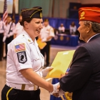 Christine Lupacchino of Easthampton, Mass., Post 224 shakes the hand of American Legion National Commander Charles E. Schmidt during the 2017 American Legion Color Guard Contest, held on Friday, August 18, 2017 at Reno-Sparks Convention Center in Reno, Nev. Photo by Lucas Carter/The American Legion.