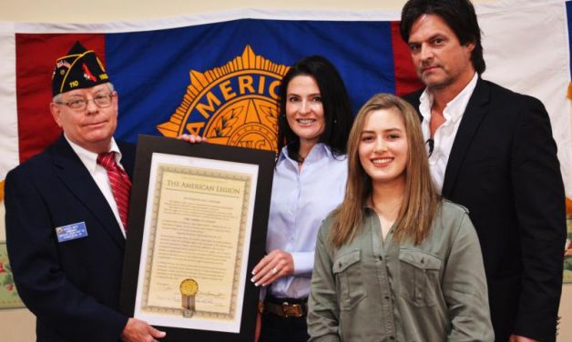 Post 110 presents copy of new post charter to Melberg family 