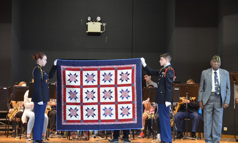 Longtime Ansbach community member receives quilt from 9th JROTC