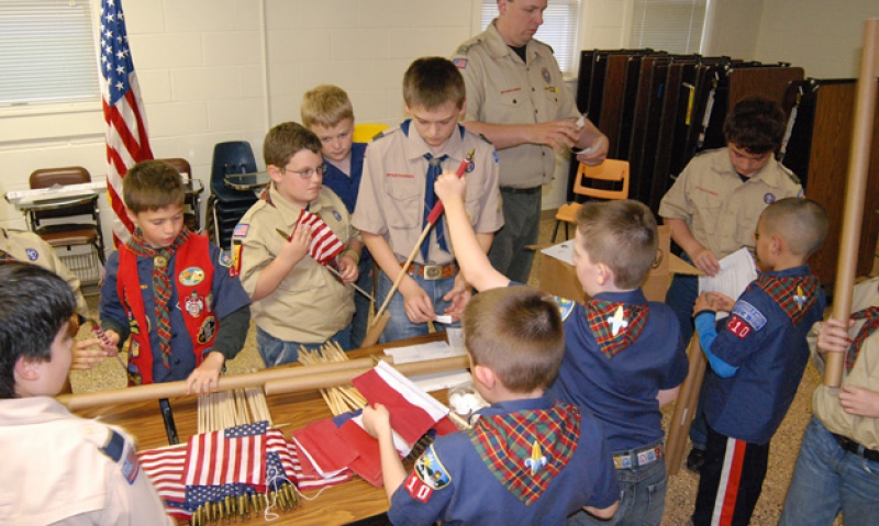 Scouts prep U.S. flags for isolated graves