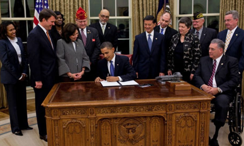 Hill watches Obama sign vet employment order