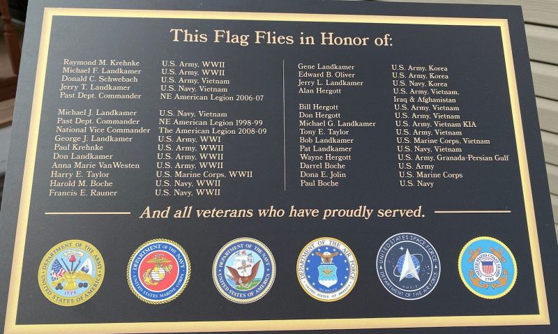 Husband, wife honor military family history with 70-foot flagpole and plaque